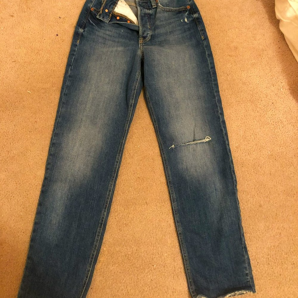 Straight leg jeans. Old Navy, high rise, size 0, tear on left leg
